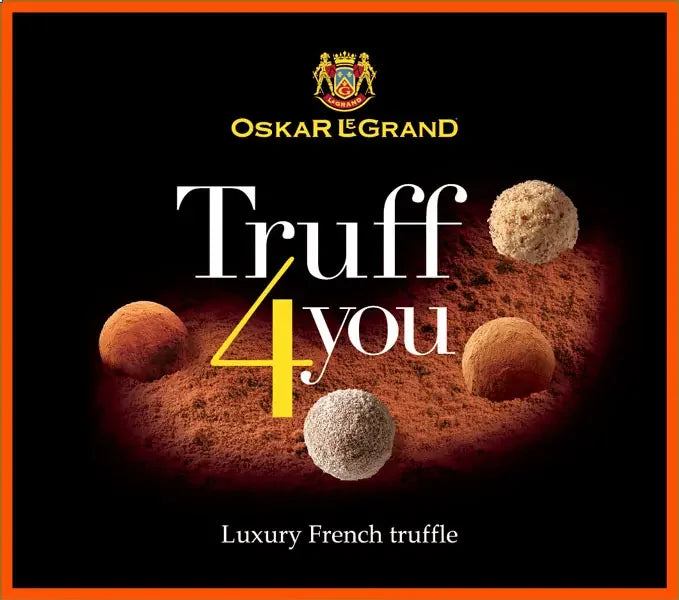 Чорна коробка Oskar le Grand Цукерки "Truff 4 You" з п'ятьма французькими шоколадними трюфелями, обсипаними какао-порошком. Помаранчева облямівка та логотип підкреслюють ці преміальні десерти з маркуванням "Розкішний французький трюфель".
