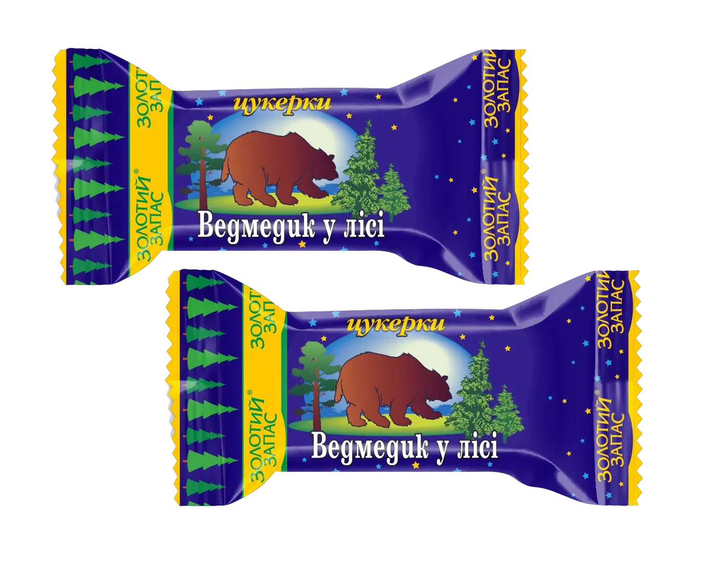 Дві цукерки Millennium "Ведмедик у лісі" (1 кг) у темно-синіх обгортках із зображенням бурого ведмедика, дерев, жовтих зірок та кириличного тексту. Нерівні жовті краї натякають на горіхову начинку всередині.
