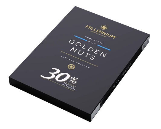 Чорна прямокутна коробка шоколаду Millennium Шоколад "Міленіум" молочний з цільним фундуком з написом Limited Edition та 30% цільного фундука містить золоті, срібні та білі написи на однотонному світлому тлі.